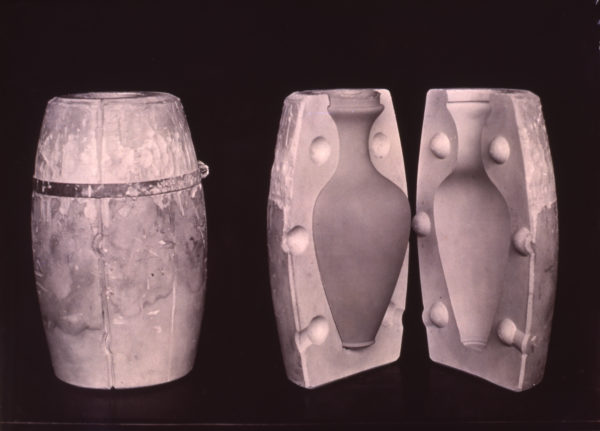 open mold shows clay vase inside