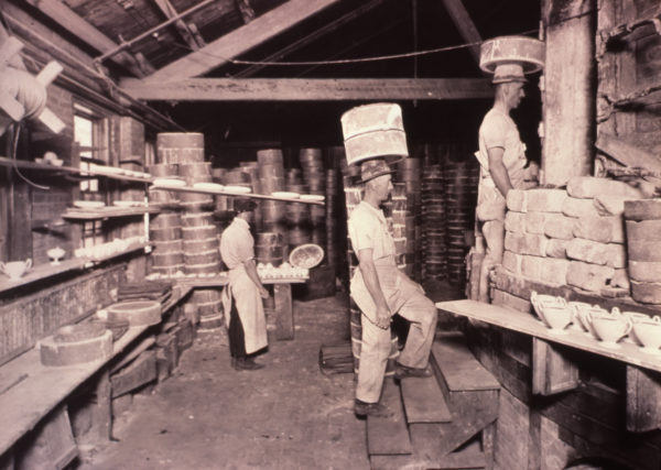 loading kiln with saggers of greenware